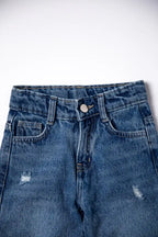 Blue denim jeans with slight distressing on a white background